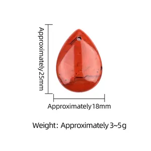 Red jasper teardrop stone pendant 25mm height with natural black veins on white background