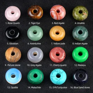 Collection of 30mm natural crystal and agate donut beads in sixteen diverse gemstone varieties