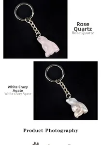 Detailed view of hand-carved frog keychains made of Rose Quartz and White Crazy Agate