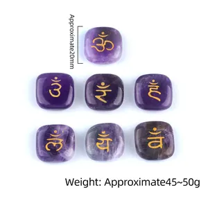 Set of 7 Amethyst chakra stones with gold engraved symbols for healing and yoga