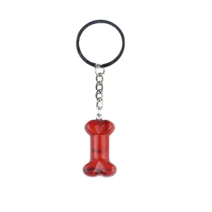 Porte-clés en pierre naturelle rouge en forme d'os de 35mm avec veines noires et chaîne