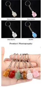 Detail view of assorted carved crystal turtle keychains with natural stone textures