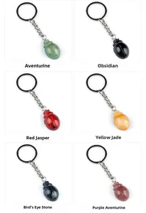 Detailed grid of beetle keychains carved from aventurine, obsidian, and red jasper stones