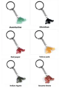 Detailed grid view of assorted dolphin keychains carved from natural gemstone materials
