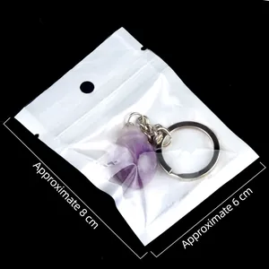 Amethyst beetle gemstone keychain pendant in packaging measuring 8x6 cm