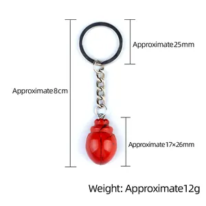 Beetle-shaped crystal agate stone keychain with red pendant and silver-tone metal ring