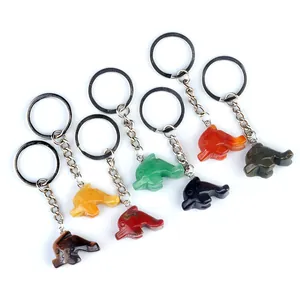 Set of six colorful hand-carved natural stone dolphin keychains in various polished gemstones