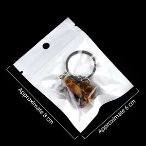 Natural tiger eye stone dog carving keychain pendant with dimensions in packaging