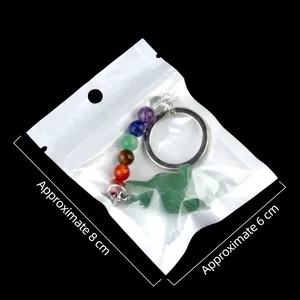 Colorful chakra crystal bird keychain with green gemstone in 8x6cm clear packaging