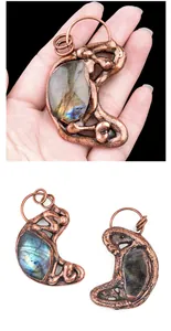 Macro view of vintage copper pendant featuring natural labradorite with iridescent flash