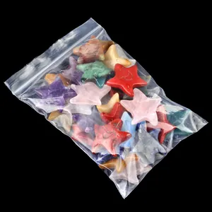 Polished natural crystal and agate star and moon stones in various healing colors