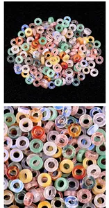Detailed macro view of colorful natural agate stone hollow circle beads for DIY jewelry