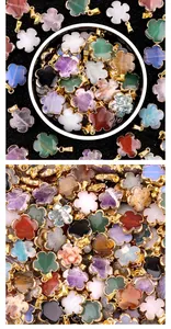 Macro shot of colorful semi-precious stone flower pendants with gold-plated metal edges