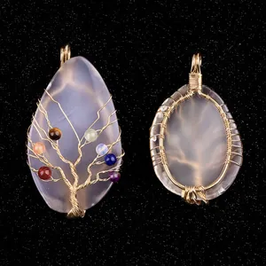 Handmade wire wrapped life tree pendant with colorful beads on grey agate slice