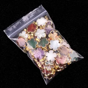 Gilded flower pendants made of natural semi-precious stones with gold-plated metal edges