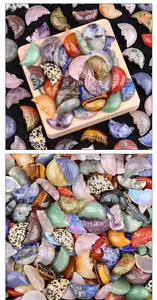 Detailed view of hand-carved natural crystal moon faces and polished agate crescents