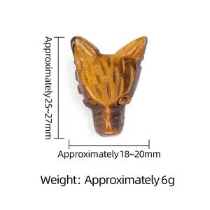 Statuetta testa di lupo intagliata in occhio di tigre naturale di misura 25x18mm