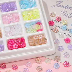 Colorful UV-plated acrylic five-petal flower beads in a 12-compartment storage box