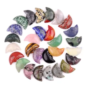 Polished natural crystal crescent moon face stone carvings in assorted colorful gemstones