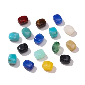 Close-up of rectangular acrylic beads with marble texture for DIY jewelry making