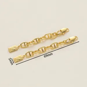 Detailed view of 18K gold-plated extension chain with oval links and Queen pendant