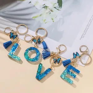 Portachiavi Con Lettera Iniziale Dolce Ciondolo a Farfalla in Resina Glitterata E Nappina Elegante Portachiavi Alfabeto Blu Rosa per Borsa Donna Regalo
