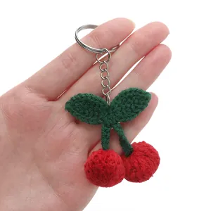 Handmade crochet red cherry keychain with green leaves and silver metal ring