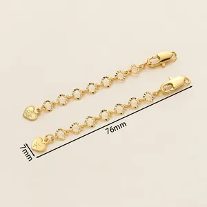 Detail of 18K gold plated extension chains with heart pendants and lobster clasps