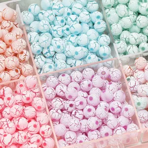 Close-up of assorted macaron colored acrylic crackle beads for DIY jewelry making