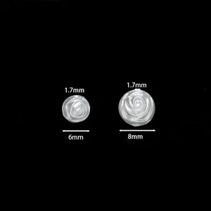 Vista dettagliata di perle a rosa bianche lucide da 6mm e 8mm per gioielli DIY