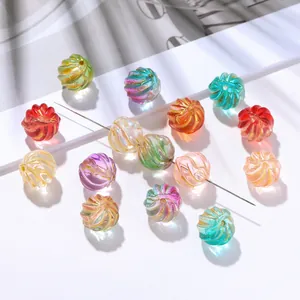 Detailed view of colorful iridescent spiral glass watermelon beads for DIY jewelry making