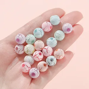 Macro shot of colorful 10mm acrylic crackle beads for DIY jewelry making and crafts