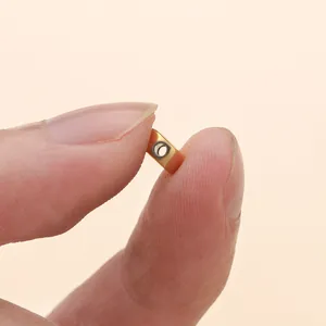 Macro shot of a 7mm gold vacuum-plated stainless steel square bead for DIY jewelry making