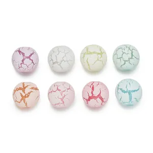 Macro view of multi-color acrylic beads with decorative crackle texture for DIY jewelry