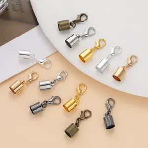 Macro detail of various metallic lobster clasp and cord end sets for DIY jewelry making