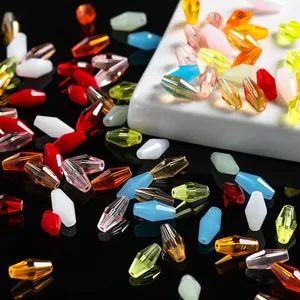 Macro detail of faceted diamond-shaped crystal glass beads for DIY jewelry making