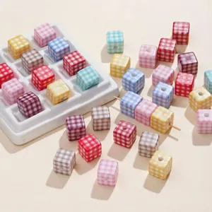 Macro shot of colorful checkered acrylic cube beads for DIY jewelry and crafts making