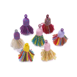 Detailed view of colorful handmade cotton thread tassels with integrated hanging loops