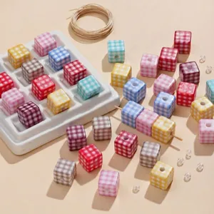 Close-up of colorful checkered acrylic cube beads for DIY jewelry making and crafts