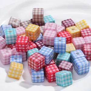 Macro shot of colorful gingham acrylic cube beads for DIY jewelry and crafts