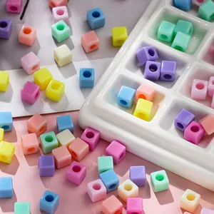 Detailed macro view of 7mm macaron square acrylic beads for DIY jewelry making