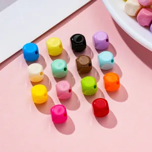 Close-up of 10mm colorful painted acrylic cube beads for DIY jewelry making