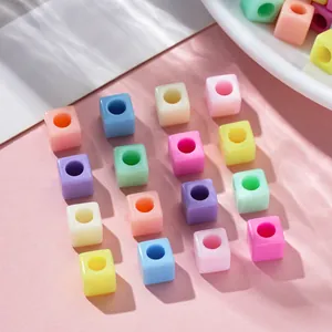 Macro shot of 7mm square macaron colored beads with large holes for DIY jewelry making