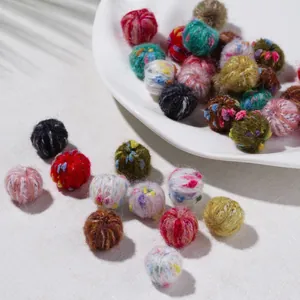 Macro shot of colorful mixed wool felt balls for DIY handmade earrings and accessories