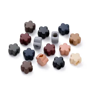 Macro shot of colorful matte acrylic flower spacers for DIY jewelry and phone chain making