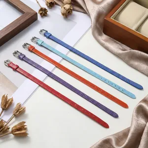 Macro detail of 8mm PU snake-skin watch bands in five vibrant colors with silver buckles