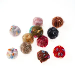 Macro detail of mixed color felt wool pom pom balls for DIY jewelry and crafts