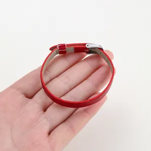Close-up of a red snake-texture PU leather wristband with an adjustable silver buckle