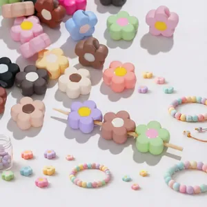 Macro shot of colorful acrylic flower beads for DIY jewelry making and handmade bracelets