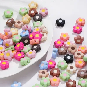 Detailed macro view of colorful five-petal acrylic flower beads with threading holes